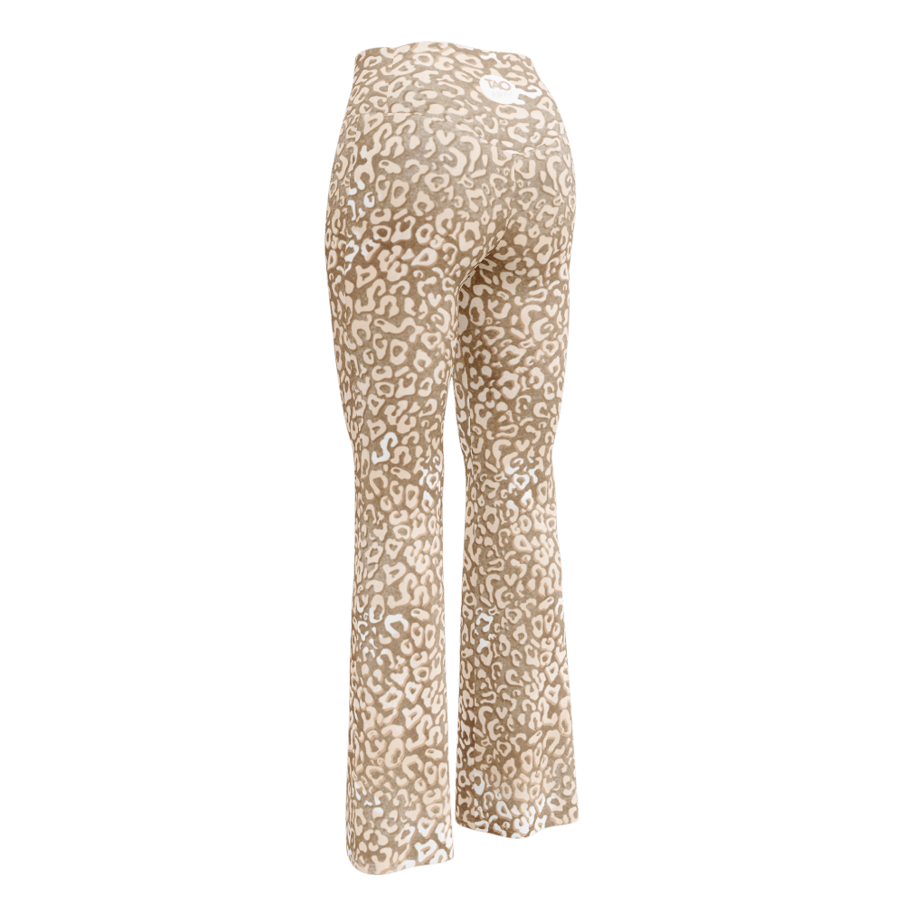 Woman wearing high-waisted leopard print flare leggings with a butt-lifting cut and double waistband, made from recycled fabric with UPF 50+ protection — bold, sculpting, and sustainably made for confident movement.