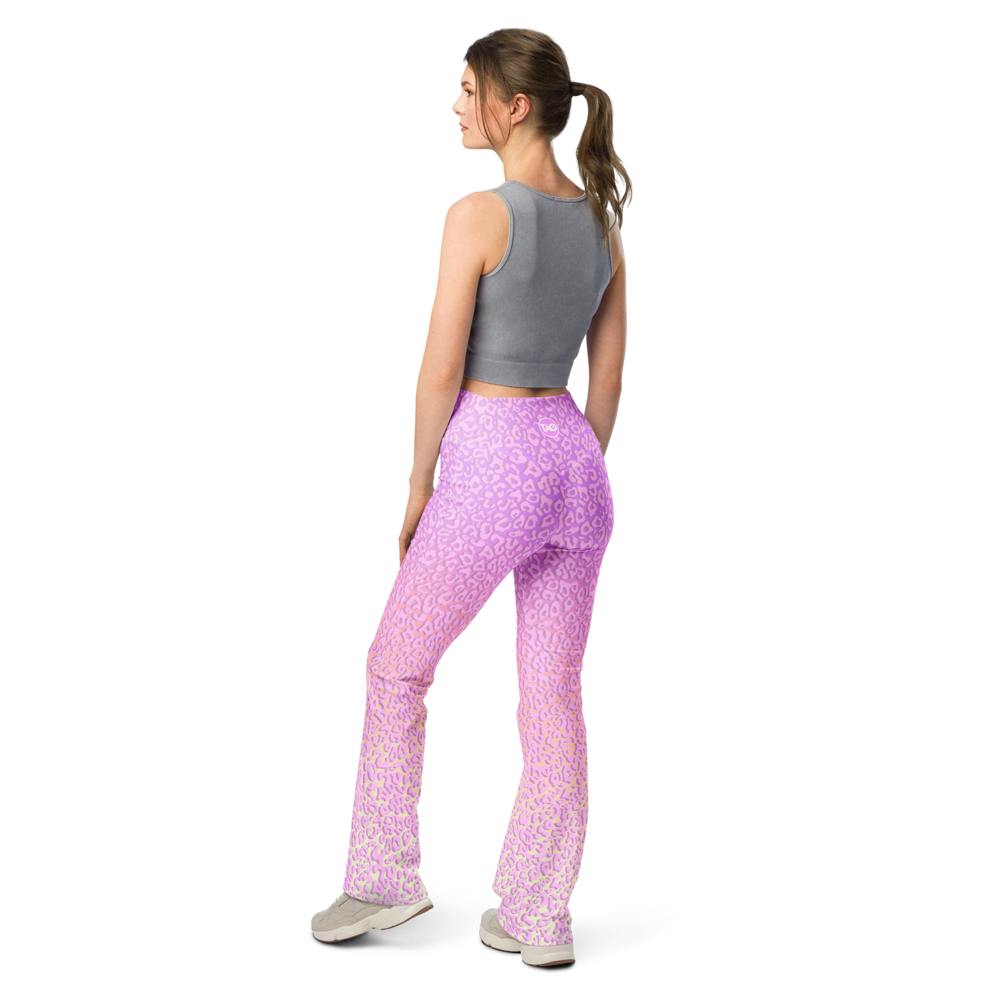 Model wearing Pinky Leo flared leggings with pink leopard print and sculpted high-waist fit – TAO Infinity