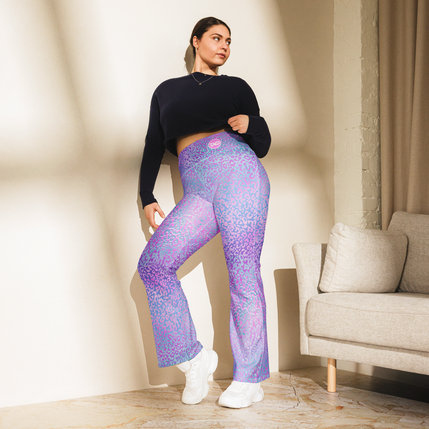 Model wearing Leopardy Purple flared leggings with bold leopard print and high waistband – TAO Infinity