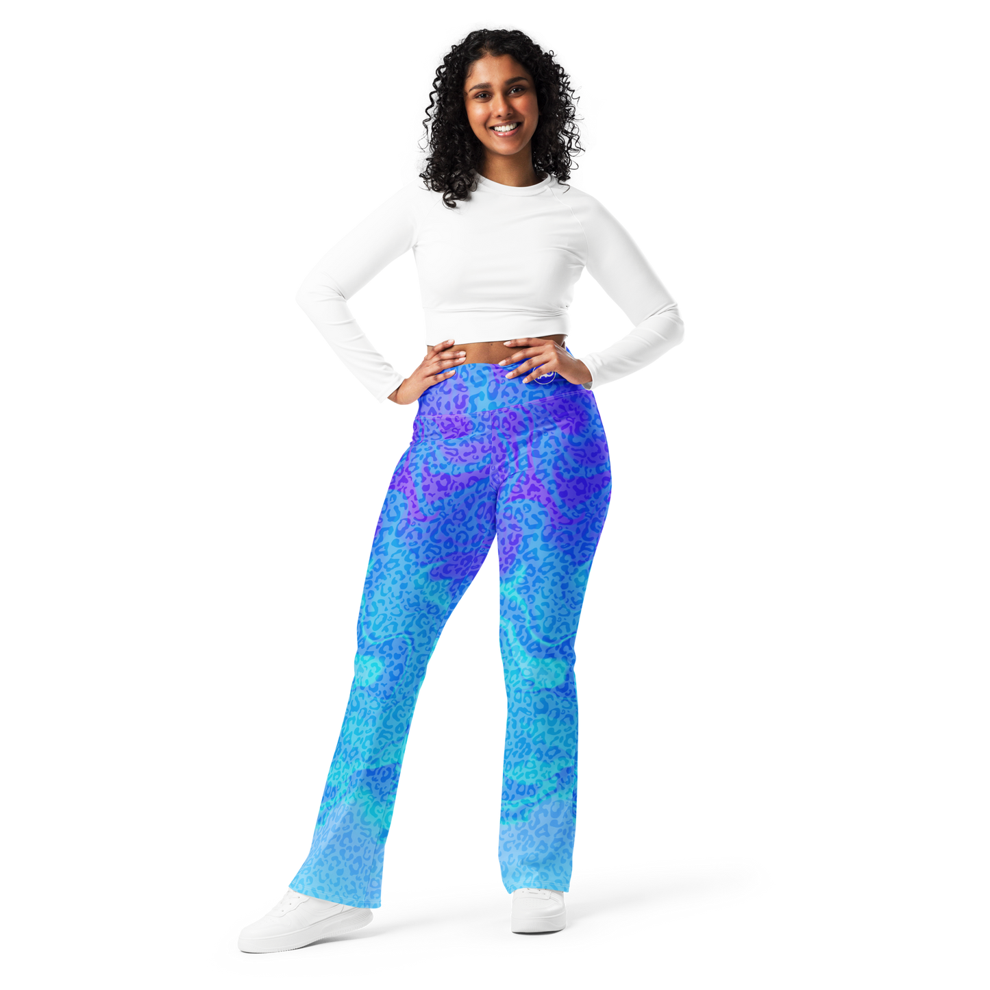 Model wearing Blue Aurora Leopardy flared leggings with high waist and vibrant leopard print – TAO Infinity