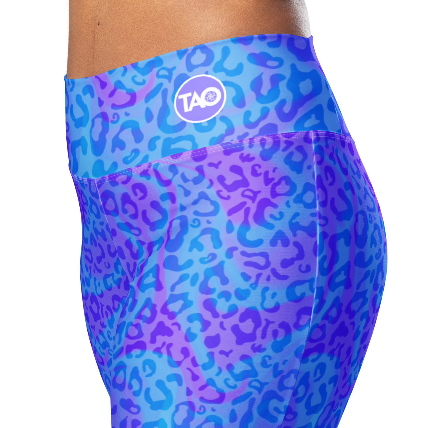 Model wearing Blue Aurora Leopardy flared leggings with high waist and vibrant leopard print – TAO Infinity