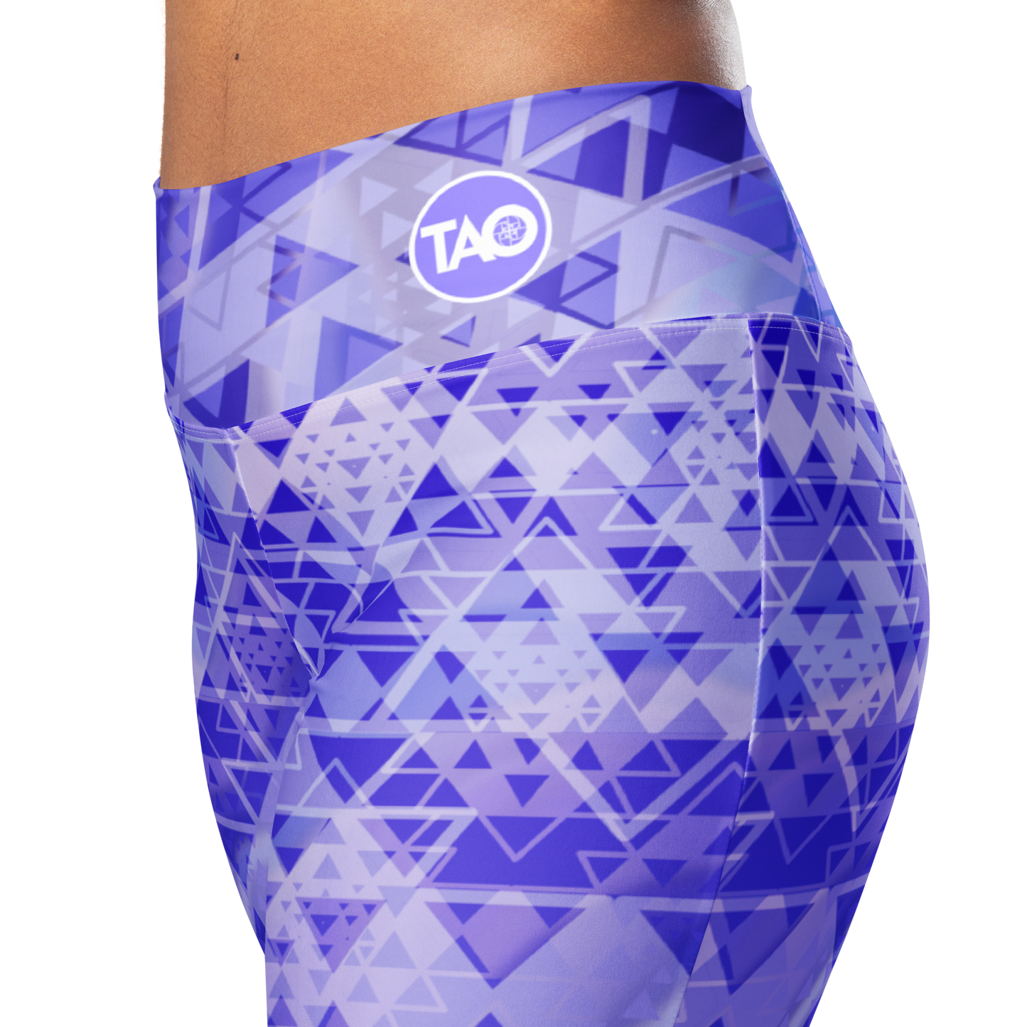 Woman wearing high-waisted flare leggings in a white, blue, and purple gradient inspired by sacred geometry, featuring a butt-lifting cut, soft compression fabric, and a double-layered waistband — designed for comfort, style, and spiritual expression.