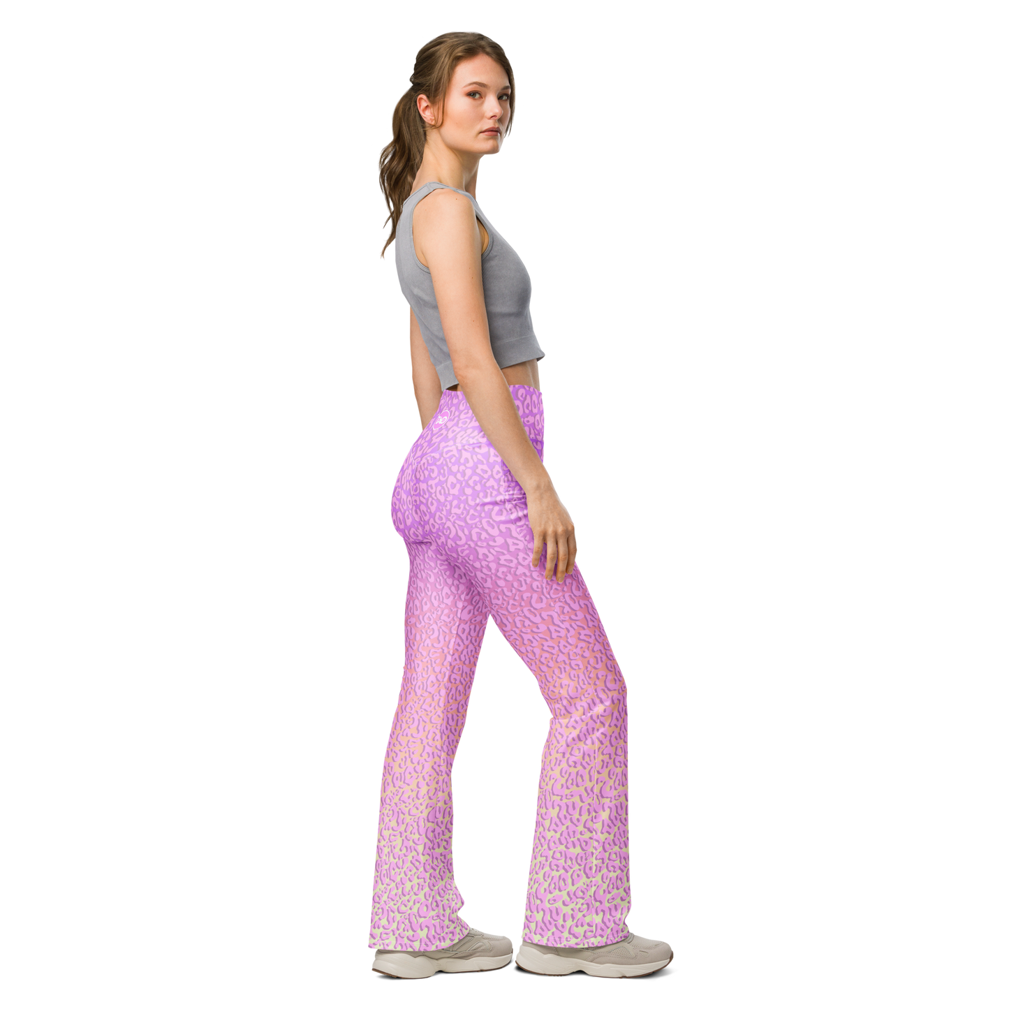 Model wearing Pinky Leo flared leggings with pink leopard print and sculpted high-waist fit – TAO Infinity