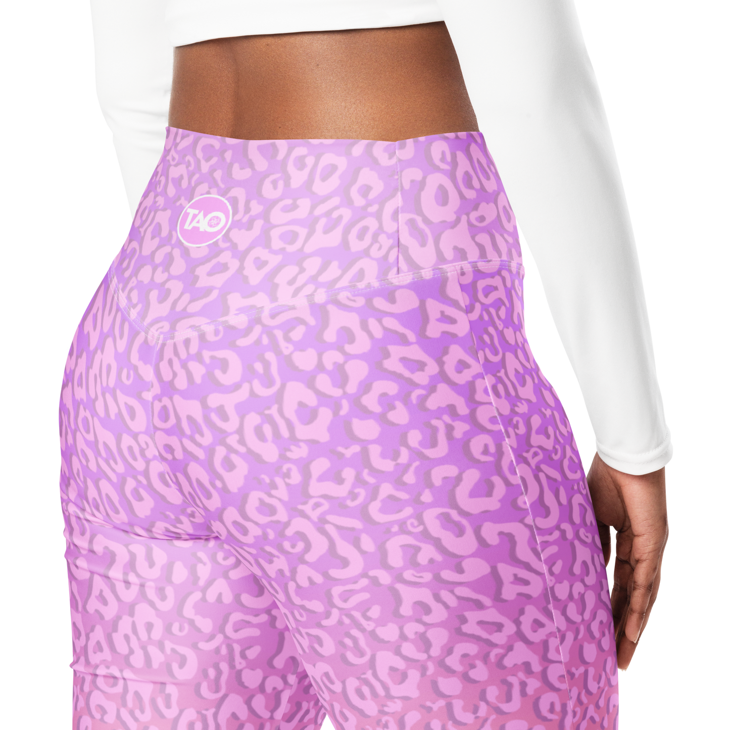 Model wearing Pinky Leo flared leggings with pink leopard print and sculpted high-waist fit – TAO Infinity