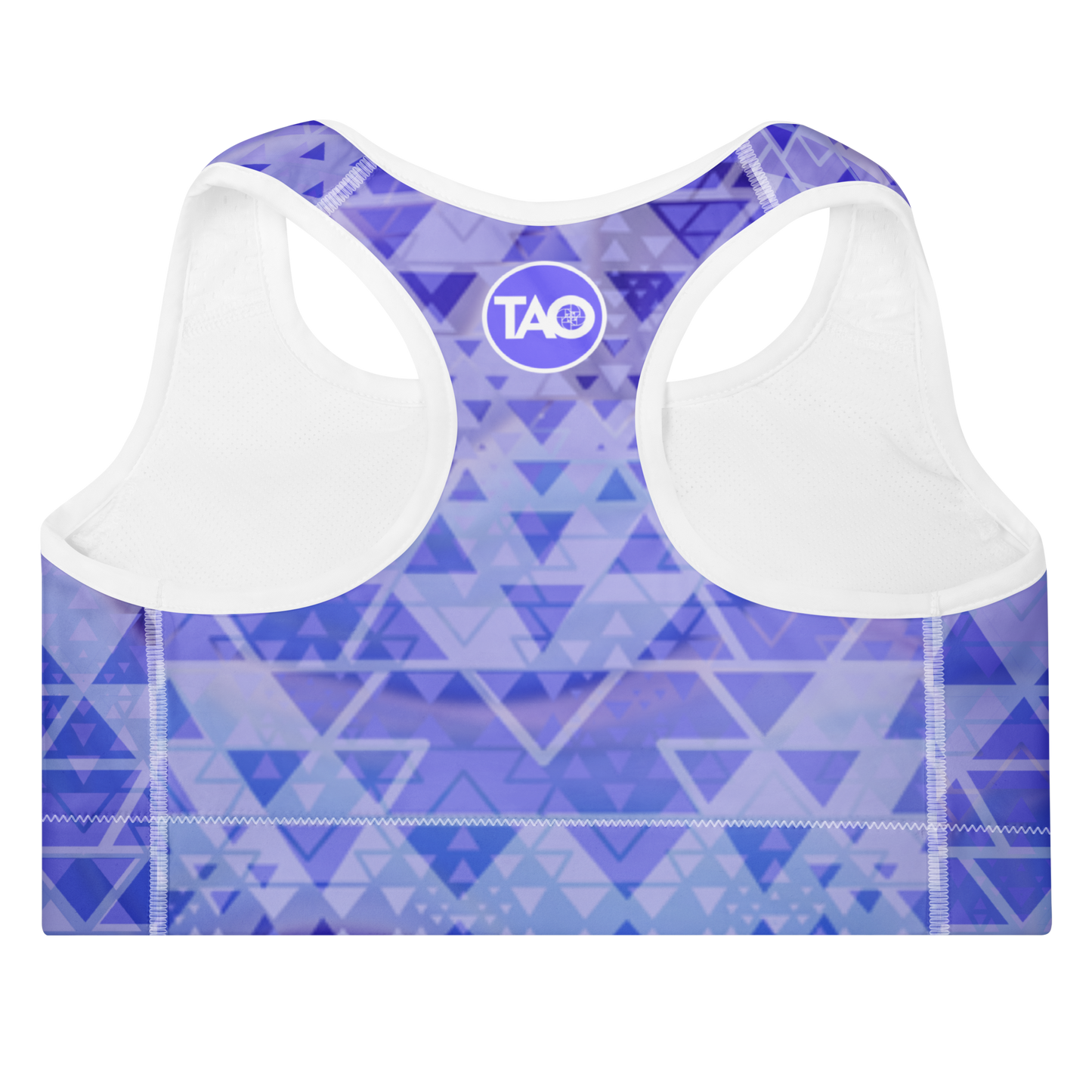 Woman wearing a blue and white sacred geometry sports bra with a scoop neckline, racerback design, and wide elastic underband — crafted for support, flexibility, and mindful movement in a spiritually inspired design.