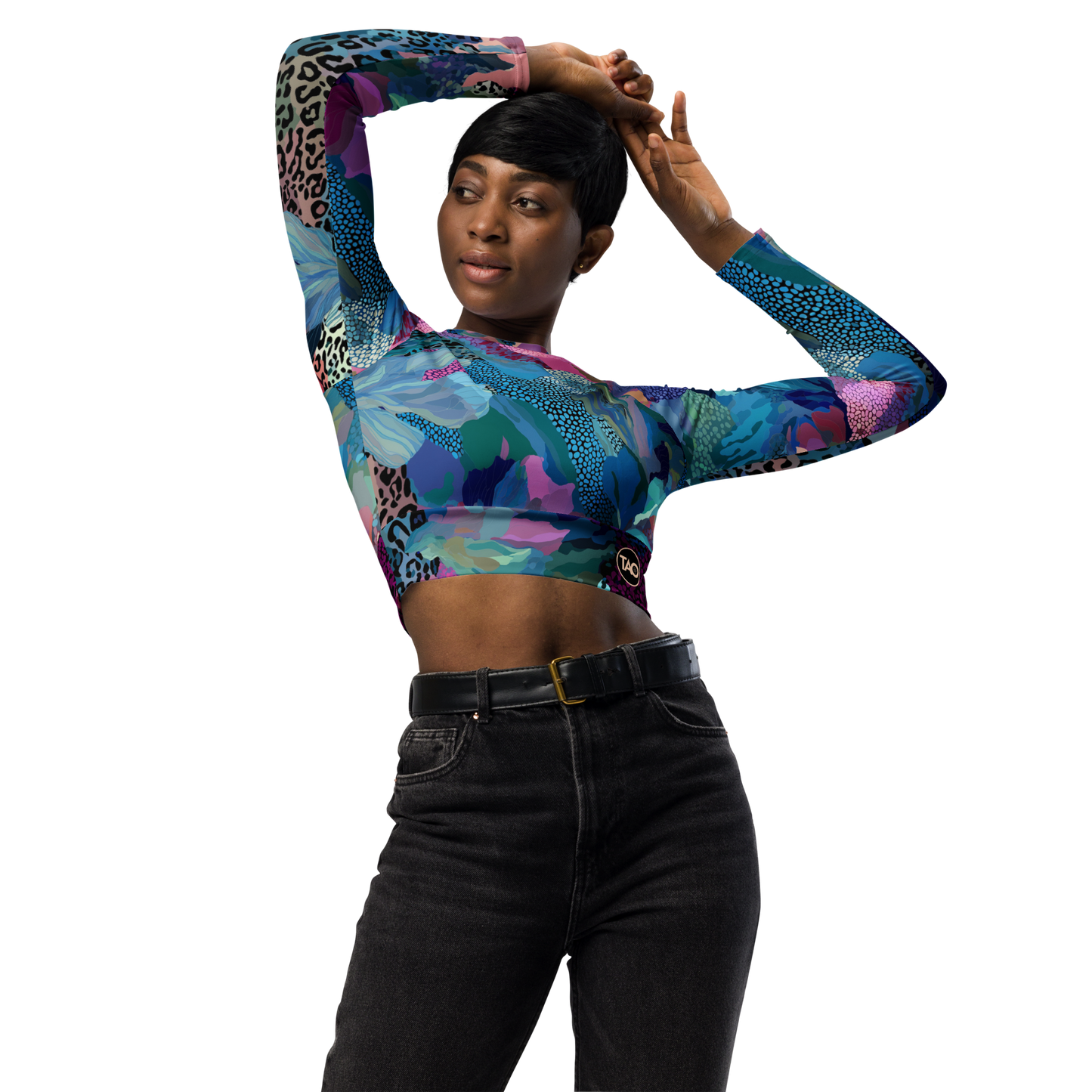 Woman wearing a blue camo-print long sleeve crop top with raglan sleeves, double-layered waistband, and UPF 50+ protection — made from recycled fabric for stylish, eco-conscious performance.