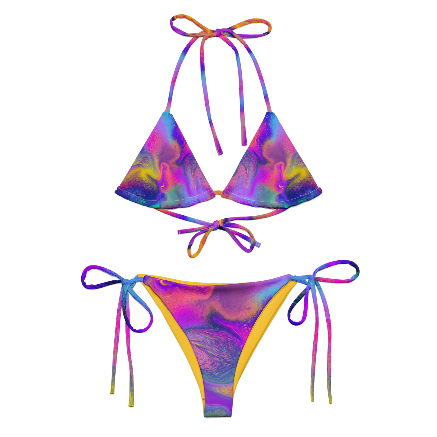 Woman wearing a colorful boho-style string bikini with adjustable straps and removable padding, made from recycled fabric with UPF 50+ — a playful and sustainable swimwear choice inspired by hippie spirit and TAO Infinity energy.