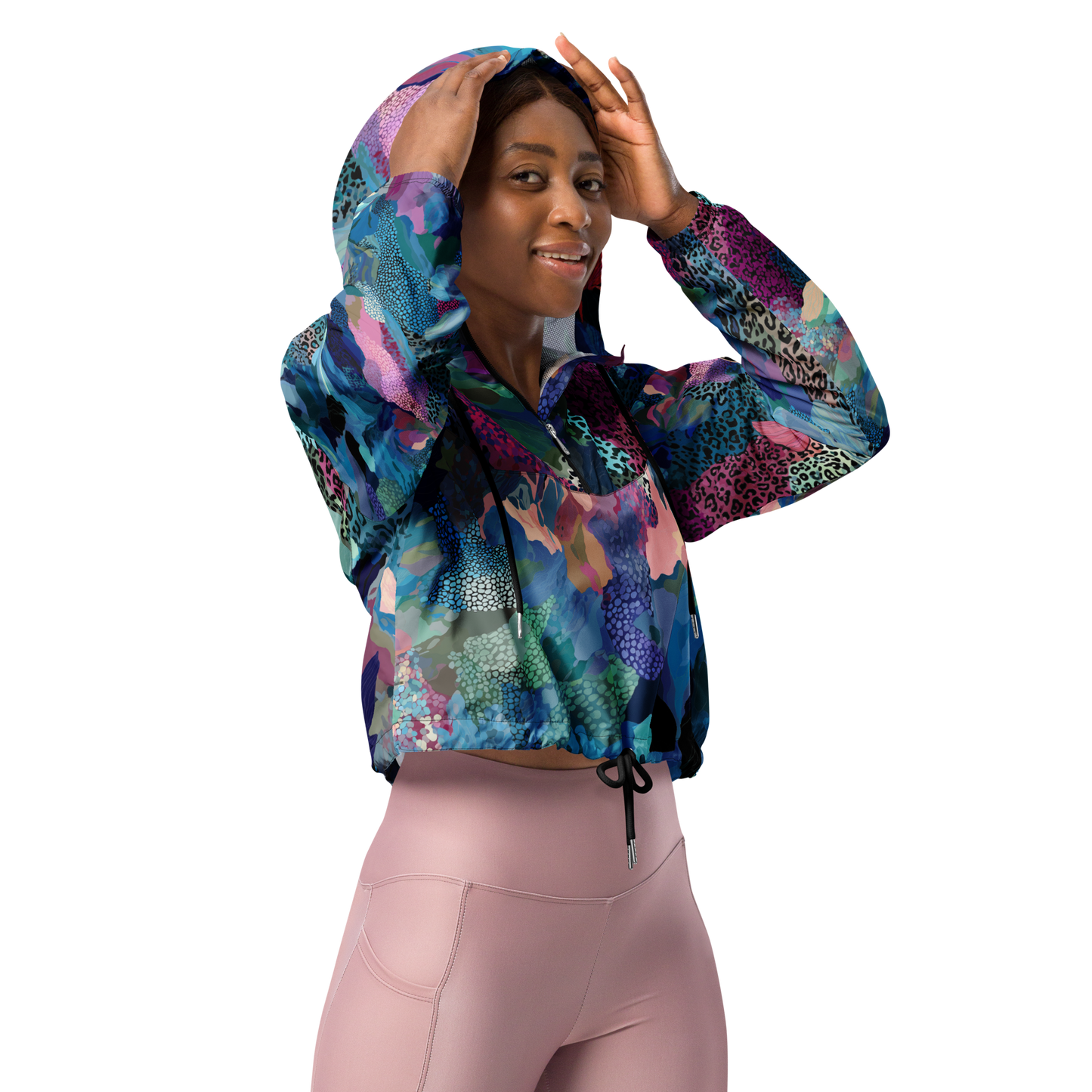 Cropped windbreaker featuring a bold blue camo print with adjustable hood and waist drawcords, breathable mesh lining, and side-slit pockets — designed for lightweight protection and standout style.