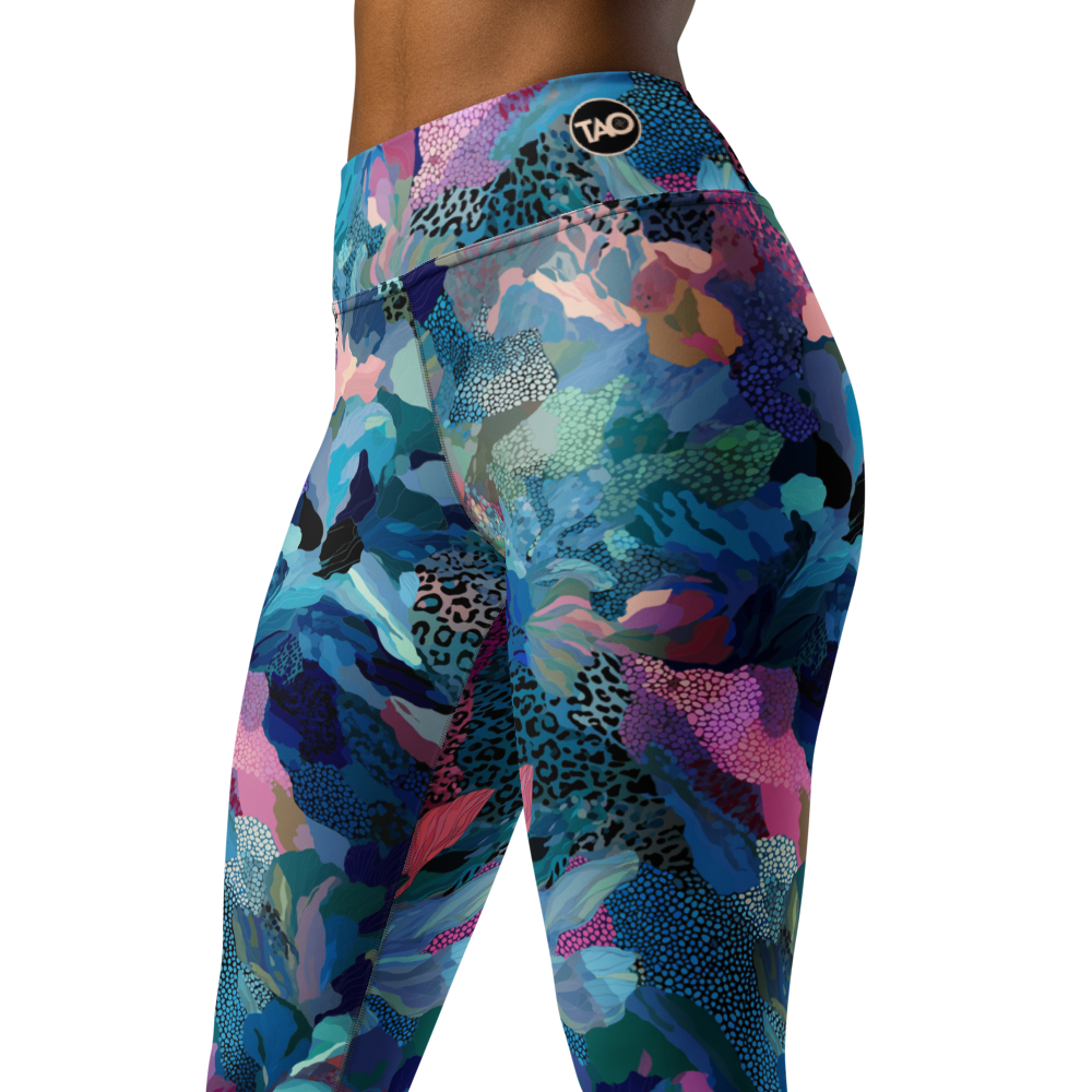 Woman wearing bold blue camo-print yoga leggings with a high waistband and sculpting fit — made from stretchy, soft microfiber fabric designed for movement, confidence, and wild self-expression.