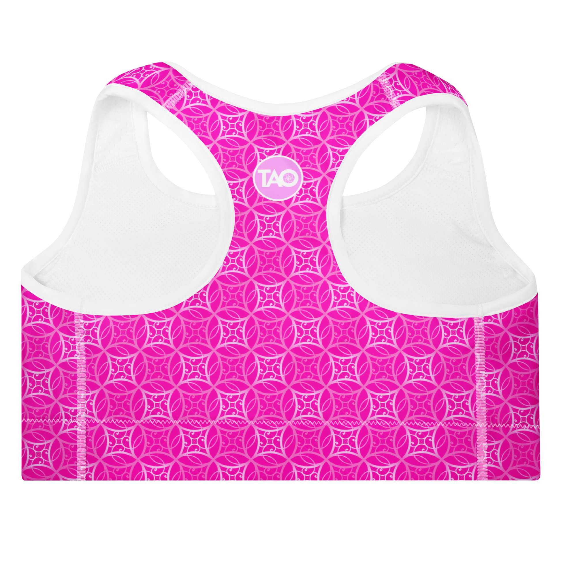 Model wearing Fibbo Pinky Sports Bra with pink sacred geometry design, featuring scoop neckline, racerback, and wide elastic band for support.