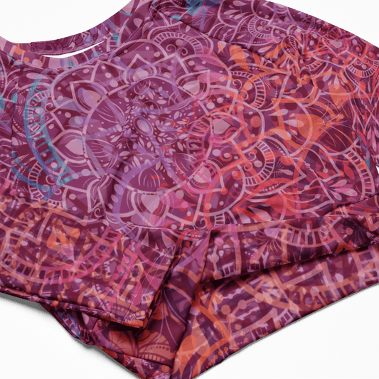a vibrant mandala-patterned long-sleeve crop top