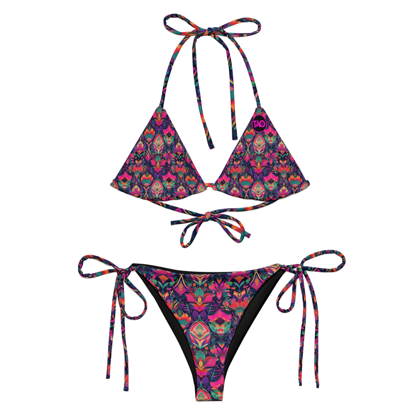 Woman wearing a vibrant jungle-patterned string bikini with sacred geometry detailing, featuring adjustable triangle top and side-tie bottoms, set against a tropical background — bold, eco-conscious, and limited edition.