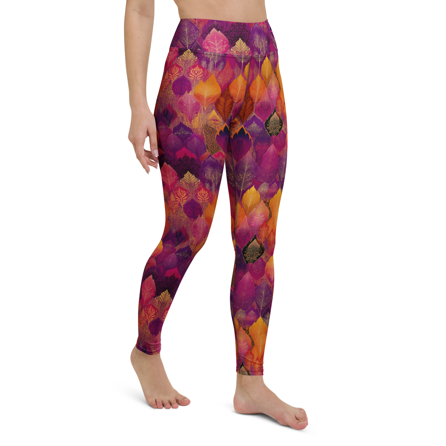 Woman wearing high-waisted yoga leggings in a bold, spice-toned Southeast Asian-inspired print, made from soft microfiber fabric with four-way stretch and a body-hugging fit.