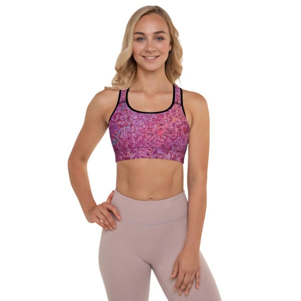 Woman wearing the Mandala Glow Sports Bra 🌈, showcasing its vibrant mandala-inspired design, racerback support, and moisture-wicking fabric for yoga and workouts.